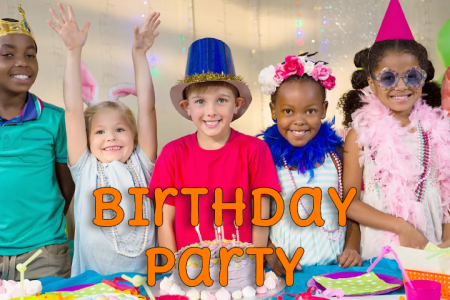 a little girl sitting at a table with a birthday cake